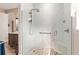 Step into luxury with this walk-in shower featuring stone floors, glass enclosures and elegant fixtures in a modern neutral bathroom at 10293 Sw 96Th Ln, Ocala, FL 34481