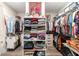 Spacious walk-in closet with ample shelving and clothes racks at 10293 Sw 96Th Ln, Ocala, FL 34481