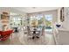 Elegant dining room with ample natural light, views of the pool, and space for comfortable gatherings at 10293 Sw 96Th Ln, Ocala, FL 34481