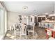 Open dining area with views to the kitchen, perfect for entertaining and Gathering meals at 10293 Sw 96Th Ln, Ocala, FL 34481