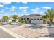 Beautiful single-story home with a brick-paved driveway, two-car garage, lush landscaping, and a charming facade at 10293 Sw 96Th Ln, Ocala, FL 34481