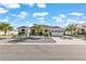 A lovely single-Gathering home featuring a well-kept lawn, landscaped garden, and a brick-paved driveway leading to a garage at 10293 Sw 96Th Ln, Ocala, FL 34481