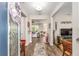 Elegant foyer featuring hardwood floors, neutral paint, and an open view of the living spaces at 10293 Sw 96Th Ln, Ocala, FL 34481