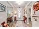 Inviting foyer showcasing wood floors, decorative accents, and views into the living spaces at 10293 Sw 96Th Ln, Ocala, FL 34481