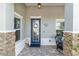 Welcoming front entrance with decorative door, charming decor, and cozy seating area at 10293 Sw 96Th Ln, Ocala, FL 34481