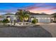 Charming home featuring a well-manicured front yard with palm trees and a paver driveway, plus a two-car garage at 10293 Sw 96Th Ln, Ocala, FL 34481