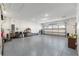 Spacious garage with epoxy flooring, equipped with ample storage and a modern garage door opener at 10293 Sw 96Th Ln, Ocala, FL 34481