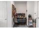 Garage with tool storage and work bench, featuring well-organized storage solutions, and epoxy flooring at 10293 Sw 96Th Ln, Ocala, FL 34481