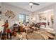 Comfortable living room featuring unique decor, ample seating, and natural light at 10293 Sw 96Th Ln, Ocala, FL 34481