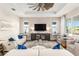 Inviting living room with stylish decor, comfortable seating, and a decorative ceiling fan at 10293 Sw 96Th Ln, Ocala, FL 34481