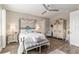 Relaxing main bedroom features a comfortable bed, stylish wardrobe, and an ensuite bathroom, perfect for relaxation at 10293 Sw 96Th Ln, Ocala, FL 34481