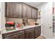 Office area with custom cabinetry, countertops and closet at 10293 Sw 96Th Ln, Ocala, FL 34481