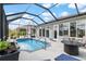 Screened in pool with a patio and beautifully landscaped outdoor space at 10293 Sw 96Th Ln, Ocala, FL 34481