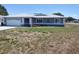 Charming single-story home with a well-manicured lawn and a two car garage, presenting curb appeal at 10315 Sw 62Nd Terrace Rd, Ocala, FL 34476