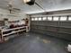 Spacious garage with work bench, tools, and full garage door at 10315 Sw 62Nd Terrace Rd, Ocala, FL 34476