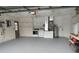 View of the garage with laundry, shelving, and a convenient side door for easy access to the exterior at 10315 Sw 62Nd Terrace Rd, Ocala, FL 34476