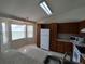 Bright kitchen featuring a breakfast bar, white appliances, and a bay window for lots of natural light at 10315 Sw 62Nd Terrace Rd, Ocala, FL 34476