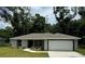 Charming one story home with a well maintained lawn and covered entryway at 11165 Nw 7Th St, Ocala, FL 34482