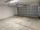 Clean garage features a sectional door and concrete flooring at 11165 Nw 7Th St, Ocala, FL 34482