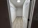 Walk-in closet with wire shelving, light floors, and white walls at 11165 Nw 7Th St, Ocala, FL 34482