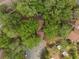 Aerial view of a home with mature trees offering ample shade and privacy at 113 Weeping Elm Ln, Longwood, FL 32779