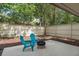 This backyard patio has outdoor seating and mature landscaping for private outdoor living and entertaining at 113 Weeping Elm Ln, Longwood, FL 32779