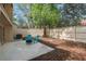 This backyard features a concrete patio, mature landscaping, and a privacy fence at 113 Weeping Elm Ln, Longwood, FL 32779