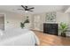 Bedroom with a ceiling fan, laminated floors and ensuite bathroom at 113 Weeping Elm Ln, Longwood, FL 32779
