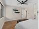 Bedroom featuring laminated floors and an ensuite bathroom at 113 Weeping Elm Ln, Longwood, FL 32779