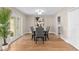 Dining room with glass-top table, seating for six, and access to the backyard at 113 Weeping Elm Ln, Longwood, FL 32779