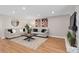 Spacious living room with stylish decor, stone fireplace, and hardwood floors at 113 Weeping Elm Ln, Longwood, FL 32779