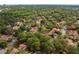 Aerial view of the neighborhood showcasing lush greenery and mature trees at 113 Weeping Elm Ln, Longwood, FL 32779