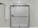 Bright shower featuring tiled walls and showerheads, with black hardware at 113 Weeping Elm Ln, Longwood, FL 32779
