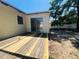 This home features a backyard deck and sliding glass door at 14646 Sw 43Rd Court Rd, Ocala, FL 34473
