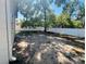 A large backyard, partially shaded with a white fence at 14646 Sw 43Rd Court Rd, Ocala, FL 34473