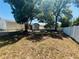 This backyard is partially shaded and includes a white fence at 14646 Sw 43Rd Court Rd, Ocala, FL 34473