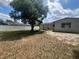 View of the backyard and the back of the home with privacy fence at 14646 Sw 43Rd Court Rd, Ocala, FL 34473