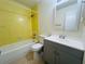 This bathroom includes a shower-tub combo with tile surround and a vanity sink at 14646 Sw 43Rd Court Rd, Ocala, FL 34473