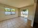 Comfortable bedroom featuring tile flooring, bright walls, sliding door access to the yard at 14646 Sw 43Rd Court Rd, Ocala, FL 34473