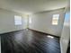 Relaxing bedroom with wood-look floors and natural light from multiple windows at 14646 Sw 43Rd Court Rd, Ocala, FL 34473