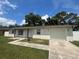 Well-maintained single-story home with a lush green lawn and a paved driveway at 14646 Sw 43Rd Court Rd, Ocala, FL 34473