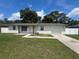 Charming single-story home with a well-maintained lawn, driveway, and white fence at 14646 Sw 43Rd Court Rd, Ocala, FL 34473