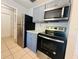 Kitchen boasts stainless steel refrigerator, microwave, and stove at 14646 Sw 43Rd Court Rd, Ocala, FL 34473