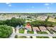 Aerial view of a home in a neatly planned community with beautiful blue sky above at 17536 Se 119Th Cir, Summerfield, FL 34491