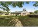 The backyard features mature trees, providing ample shade and privacy at 1866 Ne 39Th Ct, Ocala, FL 34470