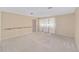 Neutral bedroom with carpeted floor, handrail, and lots of natural light at 1866 Ne 39Th Ct, Ocala, FL 34470