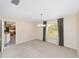Dining room with neutral paint, carpet, and a window providing natural light at 1866 Ne 39Th Ct, Ocala, FL 34470