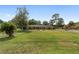 This home has a beautiful front yard and mature landscaping, with a brick exterior at 1866 Ne 39Th Ct, Ocala, FL 34470