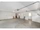Spacious garage with chairs, open doorway, and window at 1866 Ne 39Th Ct, Ocala, FL 34470