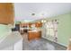 Bright kitchen features stainless steel appliances, wooden cabinetry, and a breakfast nook area at 1866 Ne 39Th Ct, Ocala, FL 34470